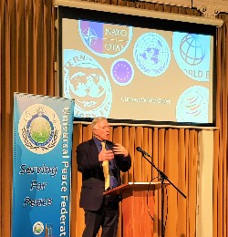 Header image showing Humphrey Hawksley presenting on Indo-Pacific tensions at a Universal Peace Federation - UK event, with slides illustrating regional issues.