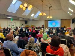 A Day to Remember – UPF UK & WFWP Seminar on Principles of Peace Dr David Hanna presenting to a large audience