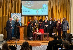 David Rennie leads an interfaith candle-lit silent prayer during the UPF UK conference on inter-religious wisdom at Lancaster Gate.
